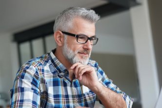 man on computer for post about Bible doctrine