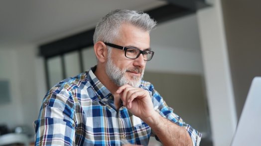 man on computer for post about Bible doctrine