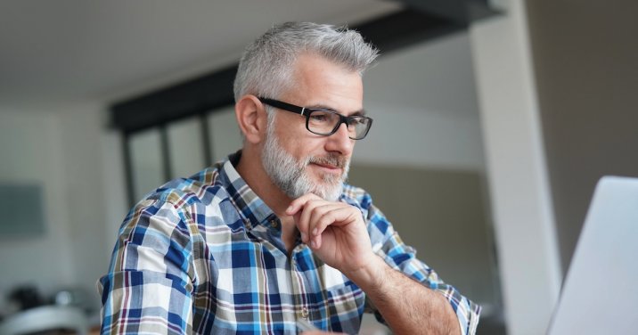 man on computer for post about Bible doctrine