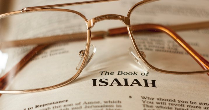 image of glasses on a bible for a post about a commentary on Isaiah