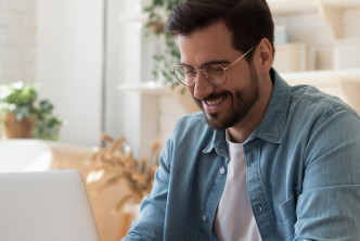 Man on computer for a post about the Theological Dictionary of the Old Testament