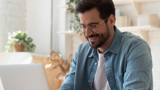 Man on computer for a post about the Theological Dictionary of the Old Testament