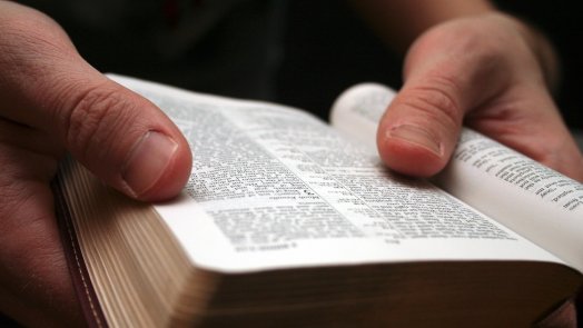 man reading Bible for a post about interpreting Scripture
