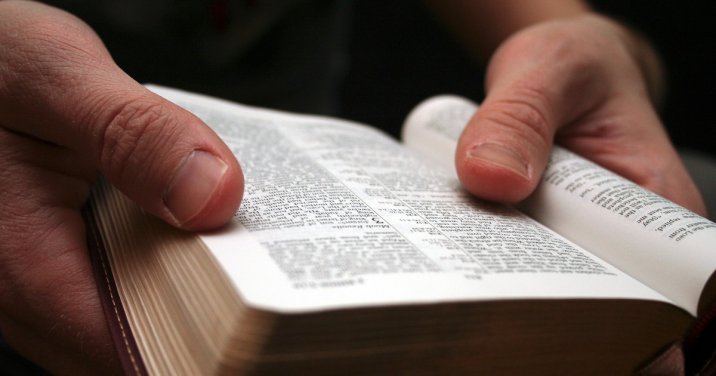 man reading Bible for a post about interpreting Scripture