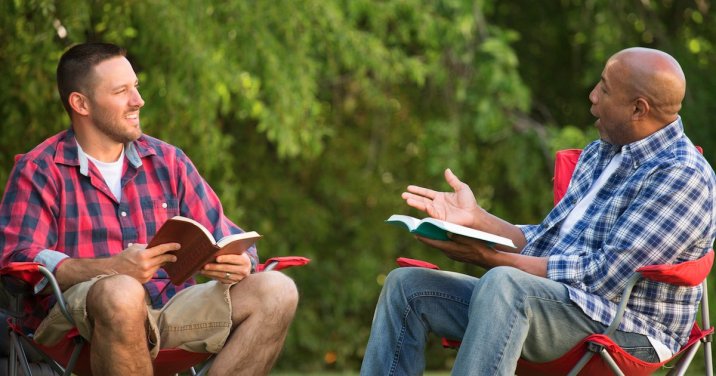 men laughing and studying the Bible for a post asking Did Jesus have a sense of humor