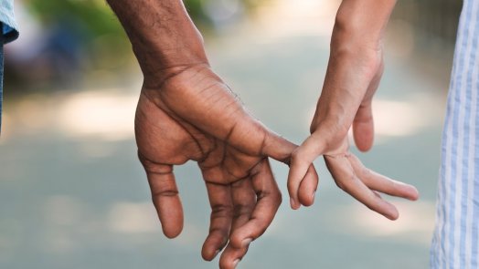 image of man and woman holding hands for a post about marriage words of wisdom