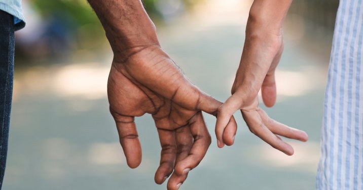 image of man and woman holding hands for a post about marriage words of wisdom
