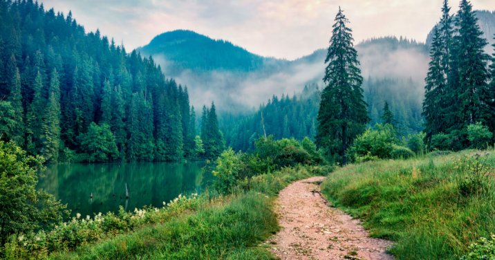 Trail next to a mountain and lake