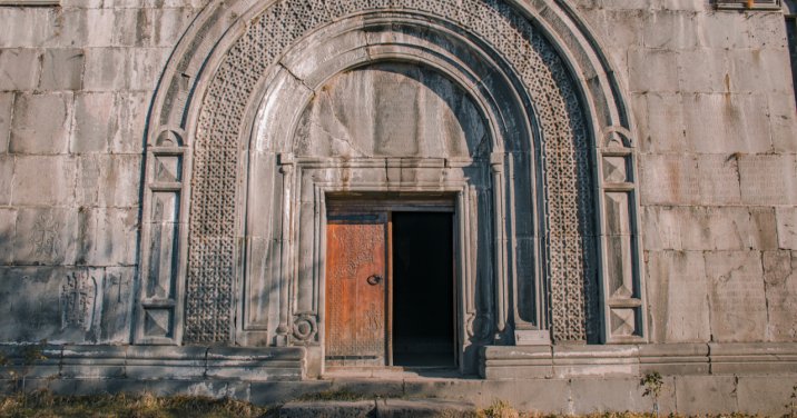Medieval door on elaborate wall
