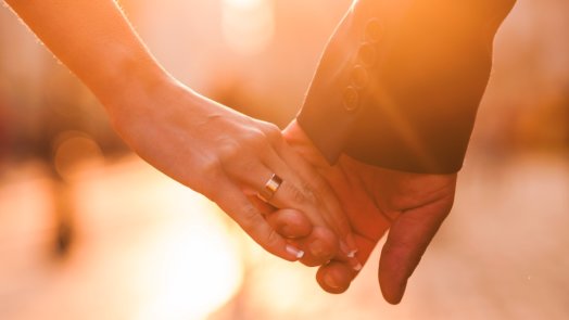 hands of man and woman on wedding day , biblical marriage blog post header image