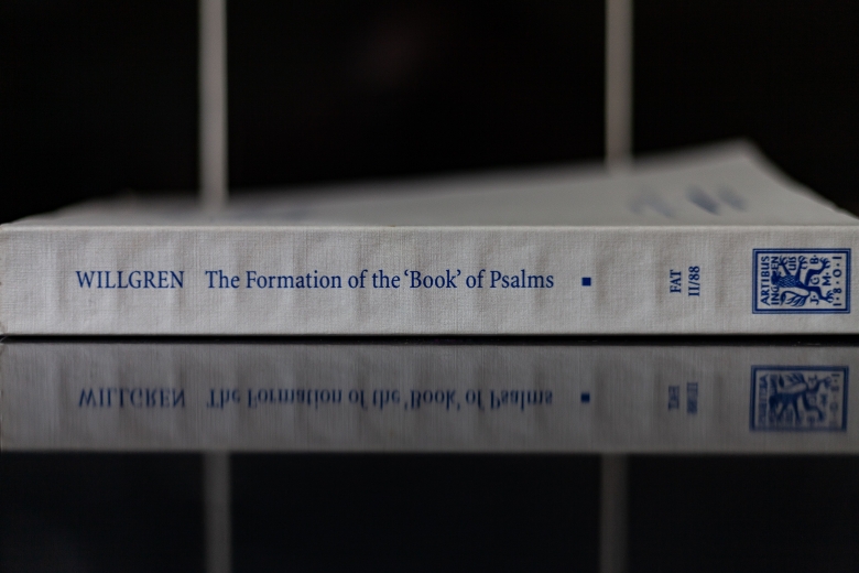 spine of The Formation of the Book of Psalms, reflecting on a shiny tabletop