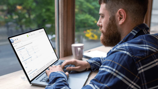 man at desk uses logos to do new testament research