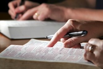 image of someone studying the bible for a post about learning how a word is translated in the Bible