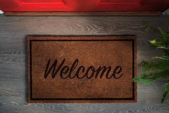 image of welcome mat for a post about how servant keeper joins faithlife