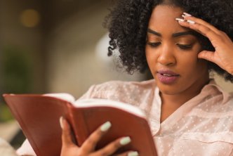 a woman reading the Bible taking care not to take verses out of context