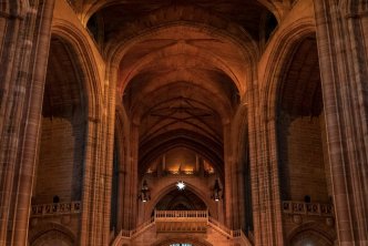 high arched ceilings in Anglican church interior, header image for anglican church beliefs article
