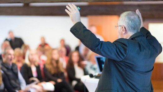 Pastor Preaching in Front of a Congregation x