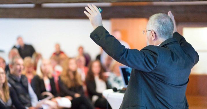 Pastor Preaching in Front of a Congregation x