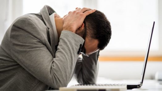 Man thinking in front of his computer