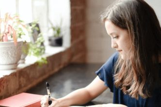 woman at desk taking church leadership training