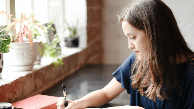 woman at desk taking church leadership training