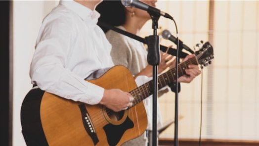 two worship leaders teaching new worship songs