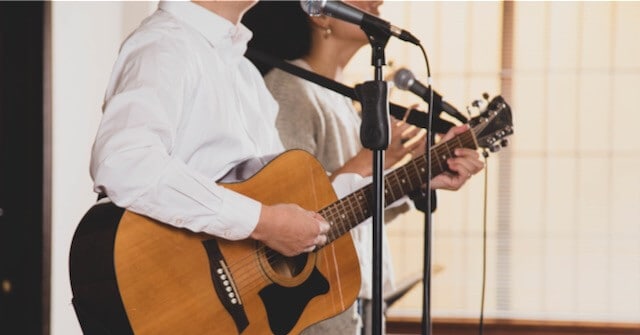 two worship leaders teaching new worship songs