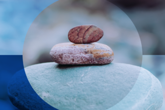 a large and small rock sit against a blue background to represent unexpected Mother's Day sermon ideas