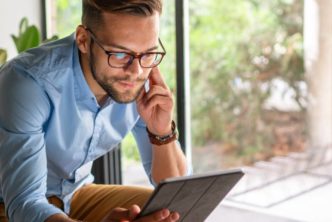 man reading one of the best Christian ebooks of 2021 on tablet