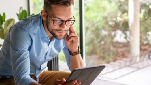 man reading one of the best Christian ebooks of 2021 on tablet