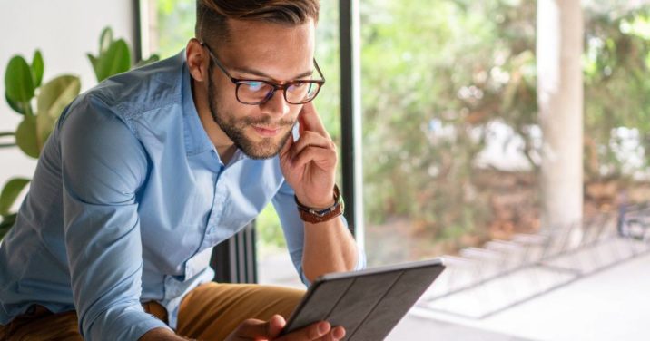 man reading one of the best Christian ebooks of 2021 on tablet
