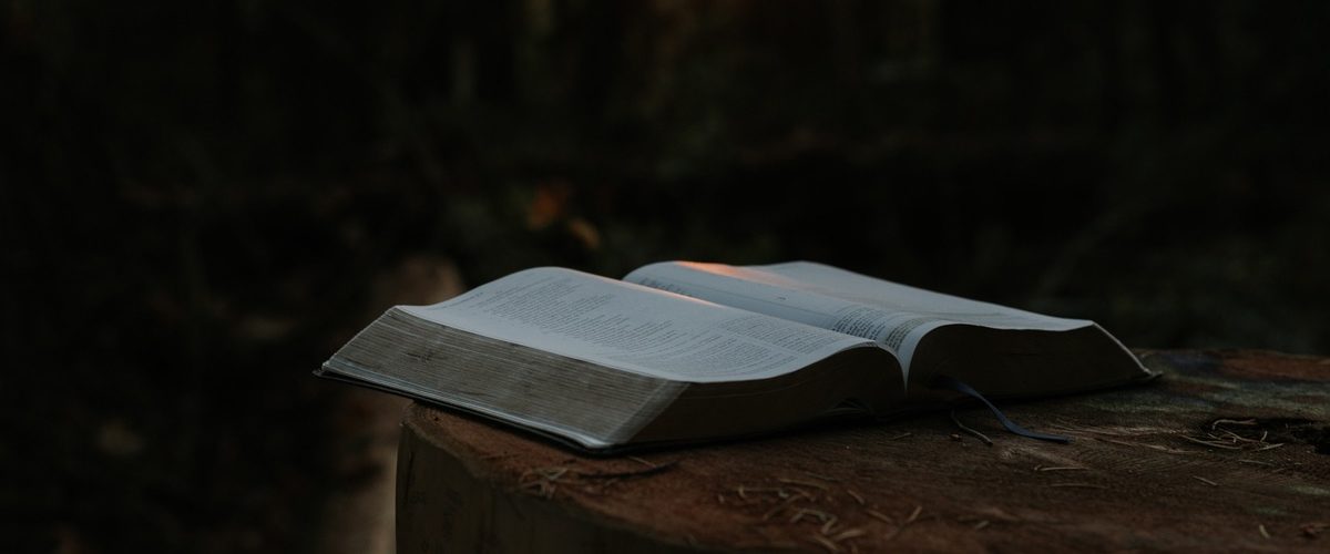 open Bible against a dark background