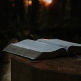 open Bible against a dark background