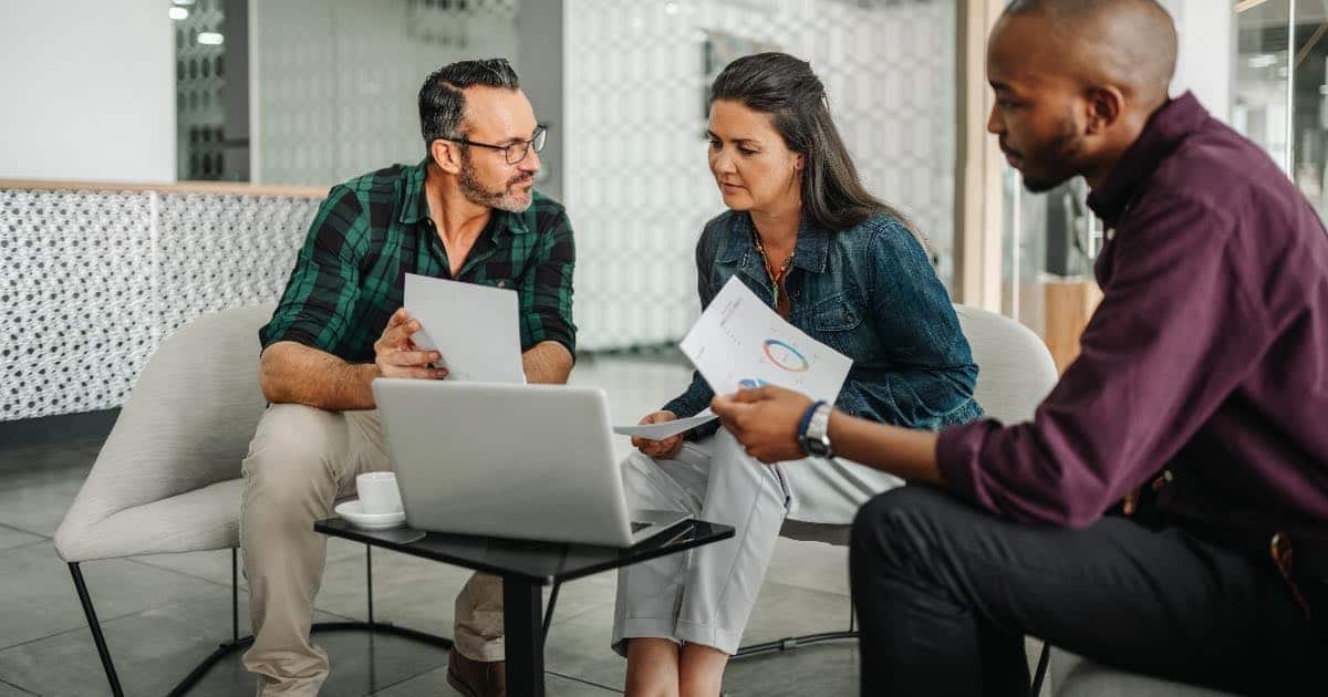 3 church leaders hold an organizational meeting