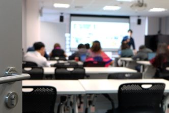 open door to a seminary classroom, students inside