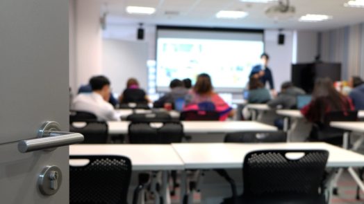 open door to a seminary classroom, students inside