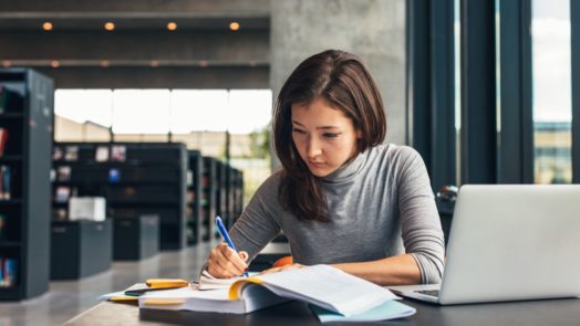 Woman writing a paper about a significant event