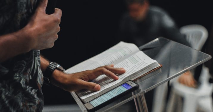 pastor at pulpit preaching to congregation