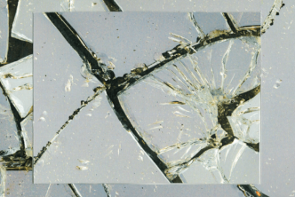 Cracked glass mirror with black background