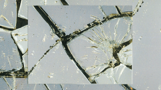 Cracked glass mirror with black background