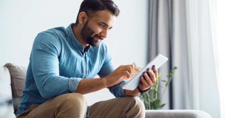 Man on tablet searches for a phrase in the Bible