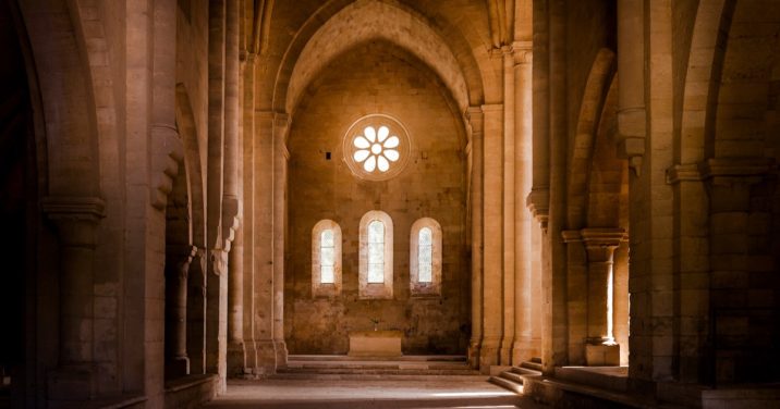 A cathedral with light streaming through windows