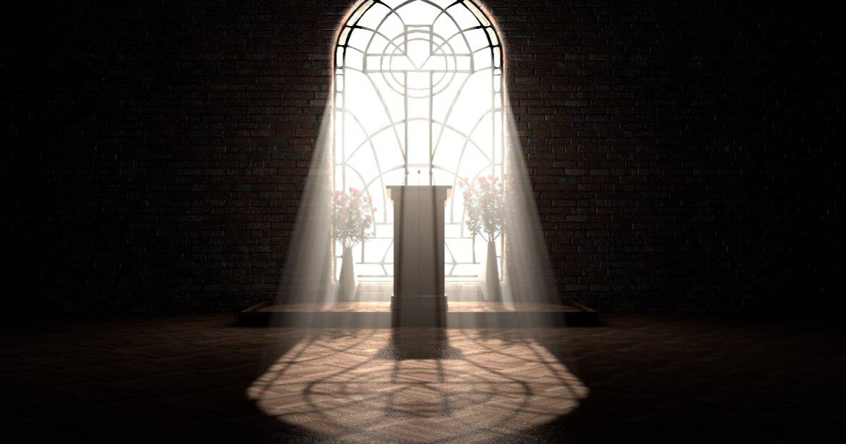 sun streams through stained glass window with cross inlay