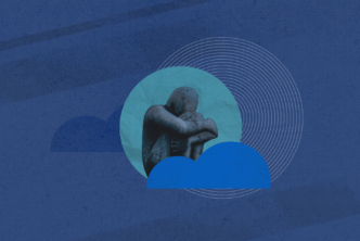 sculpture of grieving man against a blue background