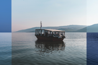 Graphic of an ancient ship on the water.